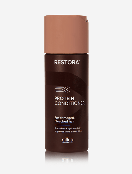 Restora Protein Conditioner transforms damaged hair into smooth and silky strands.